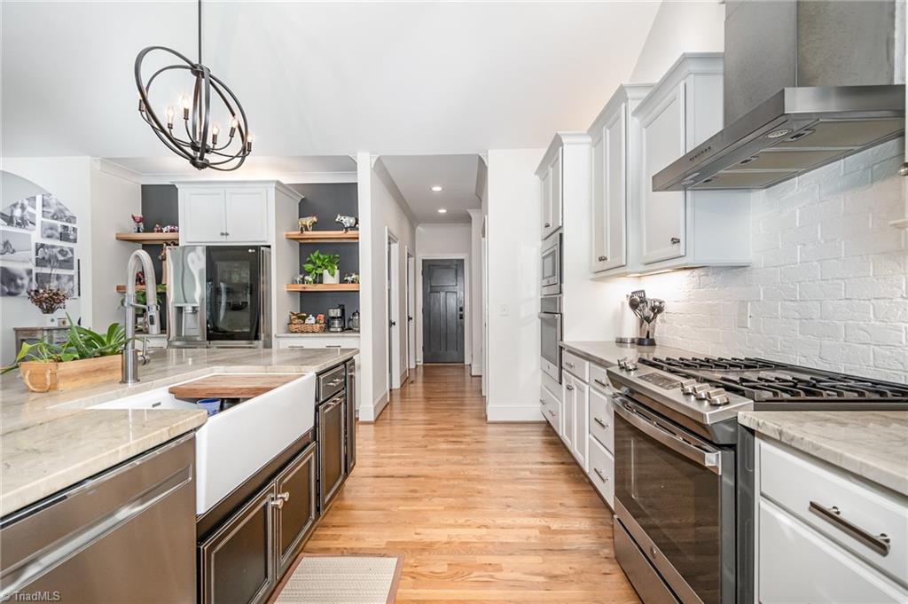 2519 Rivers Edge Road Summerfield, NC 27358 - Photo 5 of 42 Kitchen offers gas range and stainless steel appliances