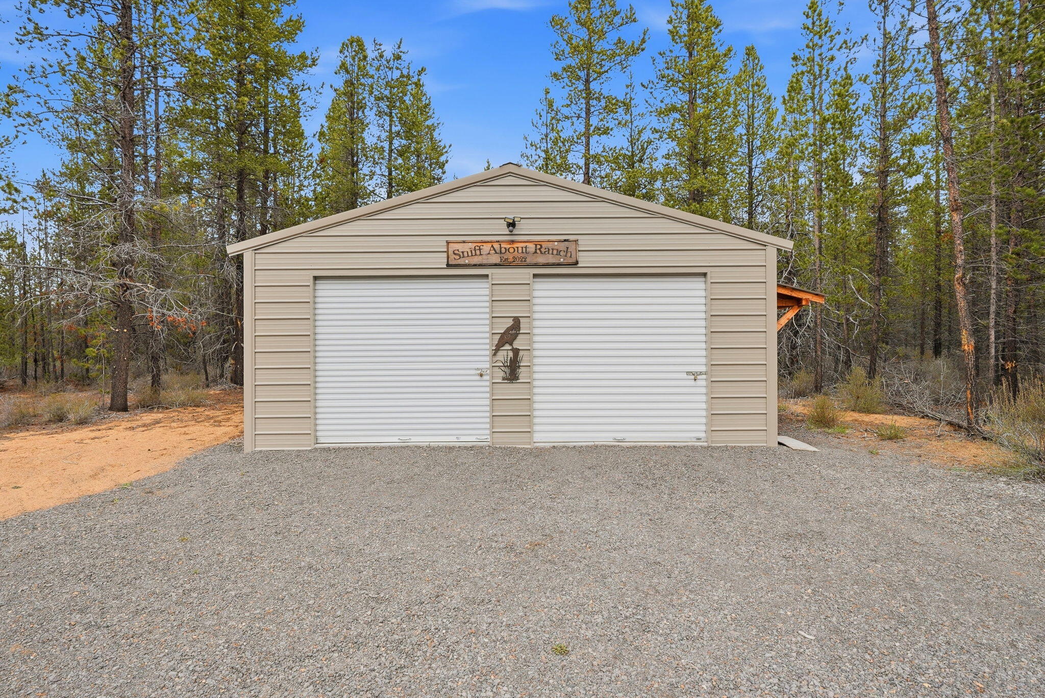 54270 Huntington Road La Pine, OR 97739 - Photo 34 of 68 a view of a house with a yard and garage