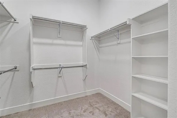 a view of an empty walk in closet