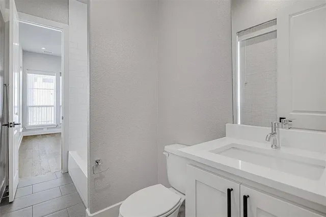 a bathroom with a sink and toilet