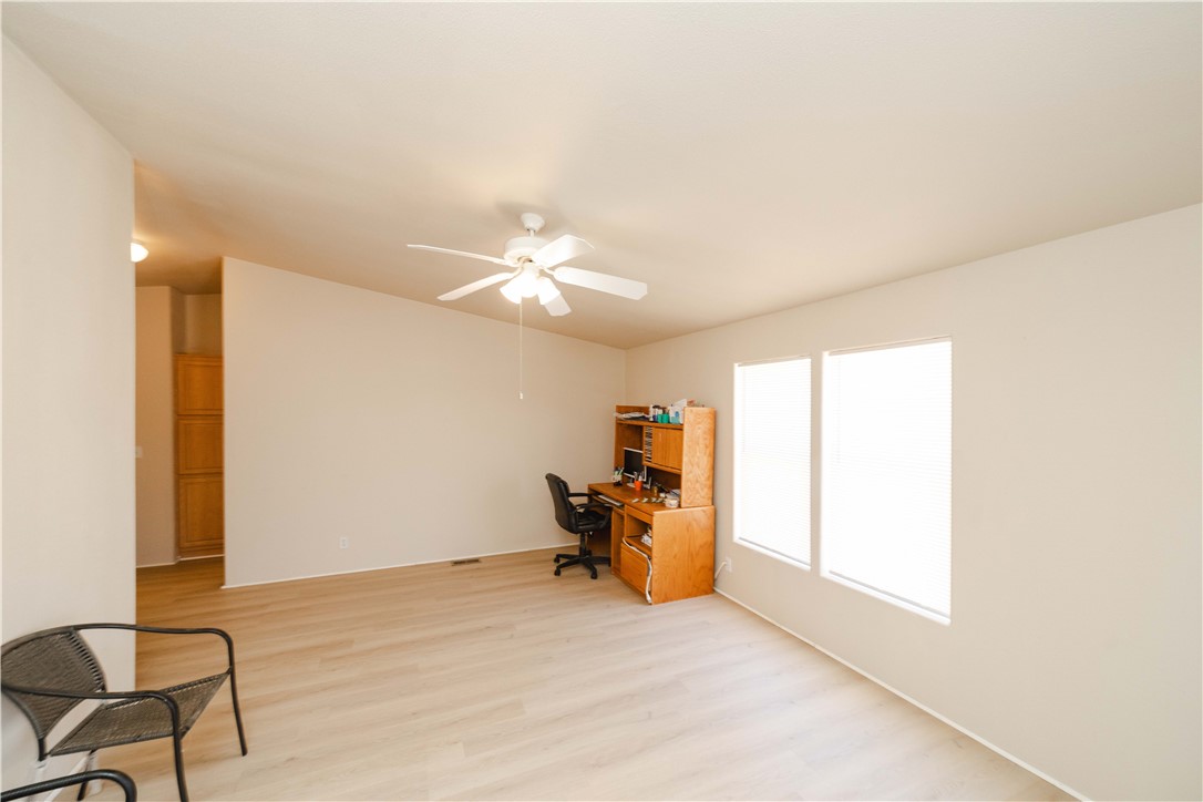 4729 Stewart Mountain Road Golden Valley, AZ 86413 - Photo 9 of 28 a view of a livingroom with furniture and chandelier