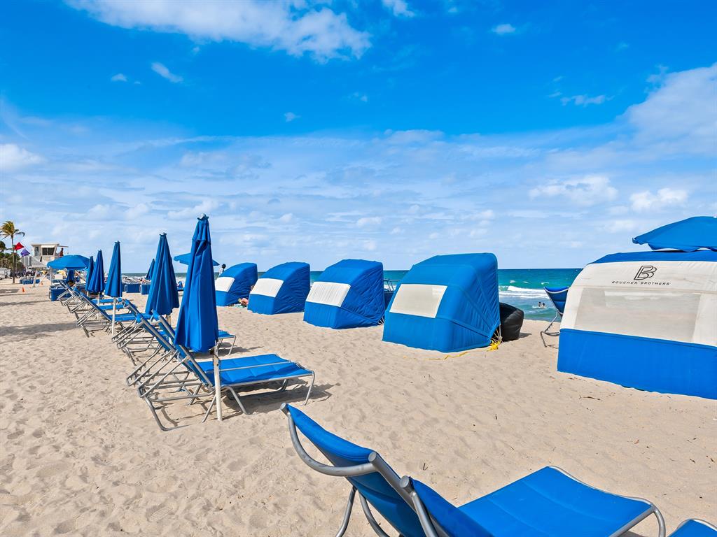 a view of swimming pool with seating space