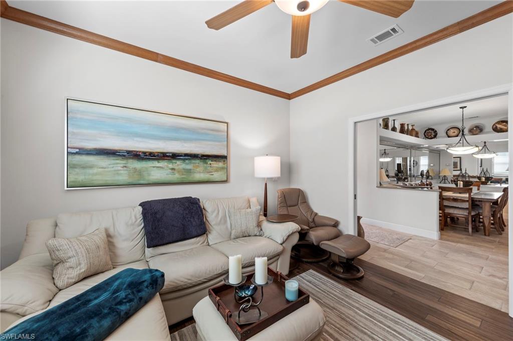 20741 Rivers Ford Estero, FL 33928 - Photo 15 of 50 a living room with furniture and wooden floor
