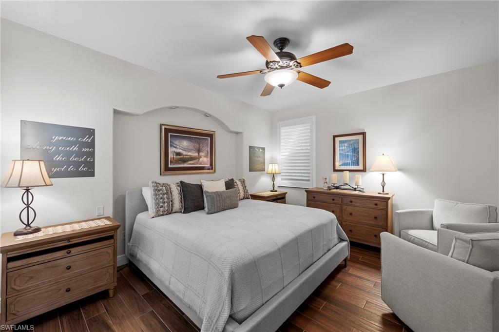 20741 Rivers Ford Estero, FL 33928 - Photo 16 of 50 a bedroom with a large bed and a chandelier