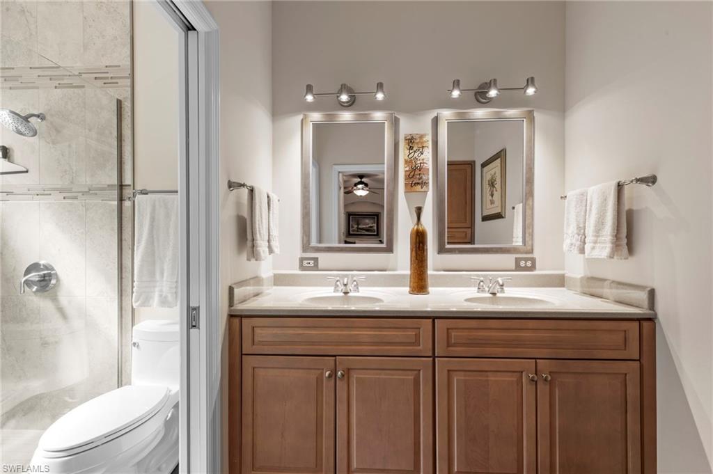 20741 Rivers Ford Estero, FL 33928 - Photo 18 of 50 a bathroom with a double vanity sink mirror and toilet