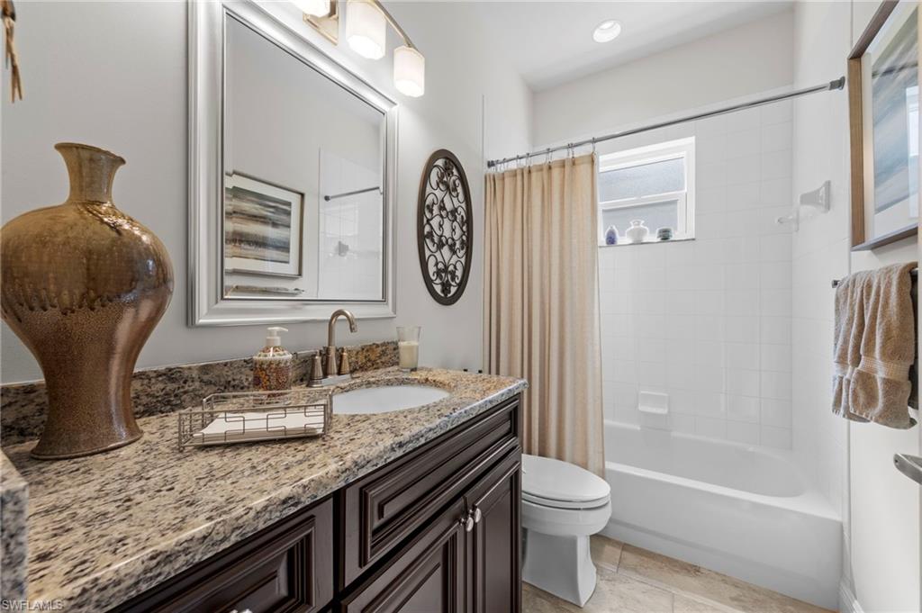 20741 Rivers Ford Estero, FL 33928 - Photo 21 of 50 a bathroom with a granite countertop sink toilet and shower