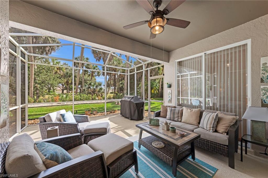 20741 Rivers Ford Estero, FL 33928 - Photo 25 of 50 a living room with lots of furniture and a floor to ceiling window