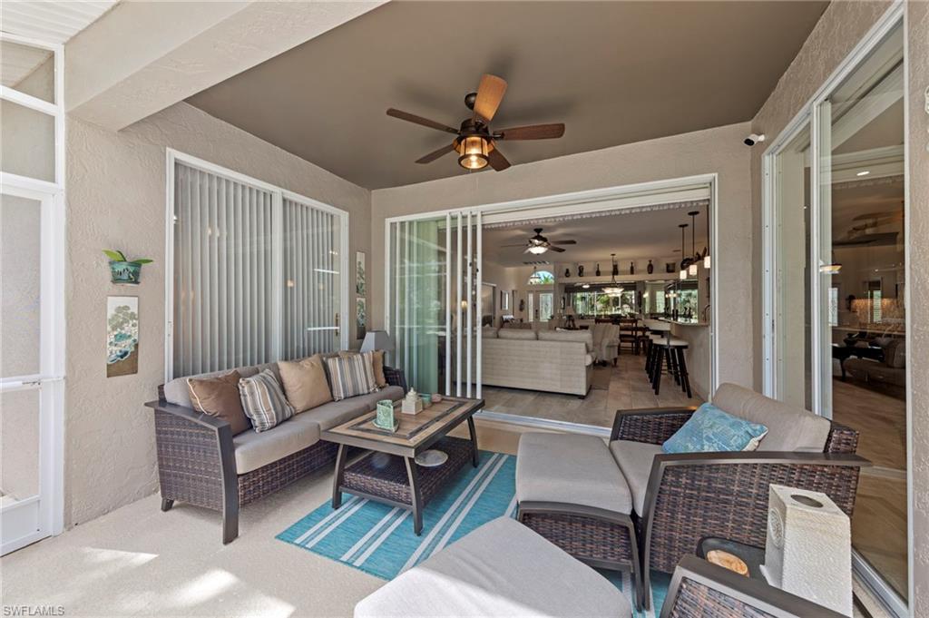 20741 Rivers Ford Estero, FL 33928 - Photo 26 of 50 a living room with furniture a ceiling fan and a rug