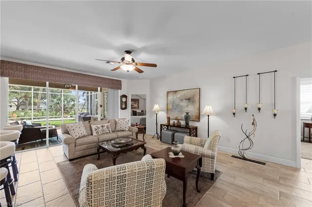 a living room with furniture or couch and a large window