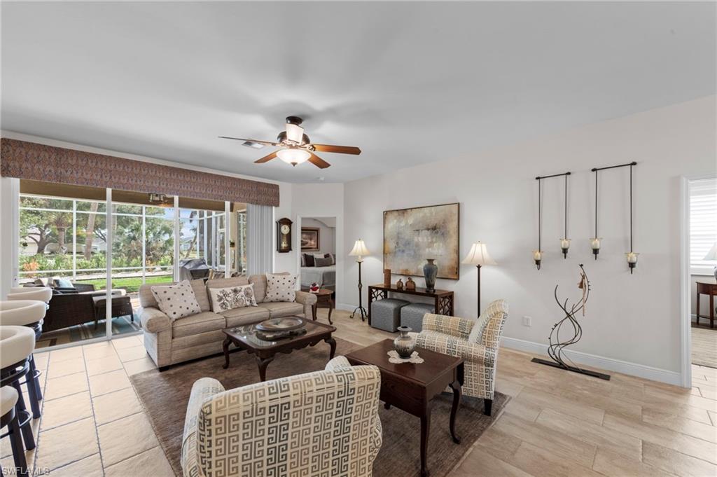 20741 Rivers Ford Estero, FL 33928 - Photo 3 of 50 a living room with furniture or couch and a large window