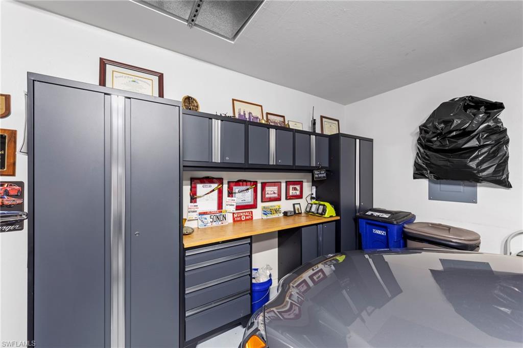 20741 Rivers Ford Estero, FL 33928 - Photo 31 of 50 a room with storage and a flat screen tv