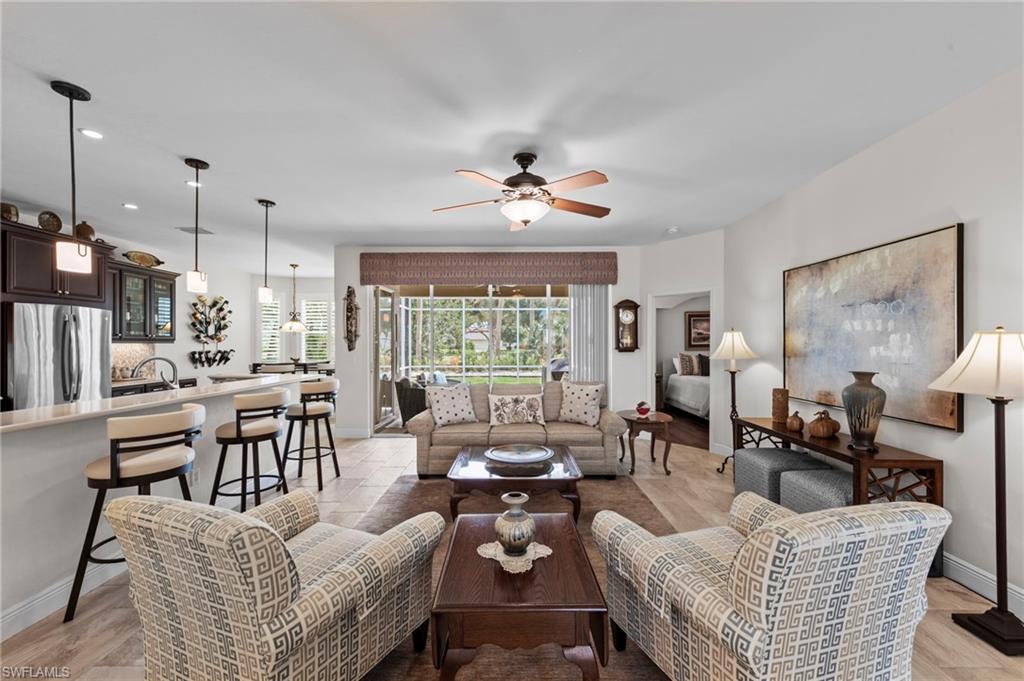 20741 Rivers Ford Estero, FL 33928 - Photo 4 of 50 a living room with furniture kitchen view and a large window