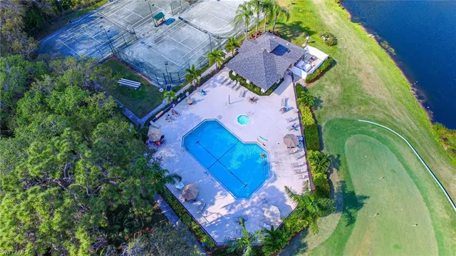 a room with gym equipment and a view of living room