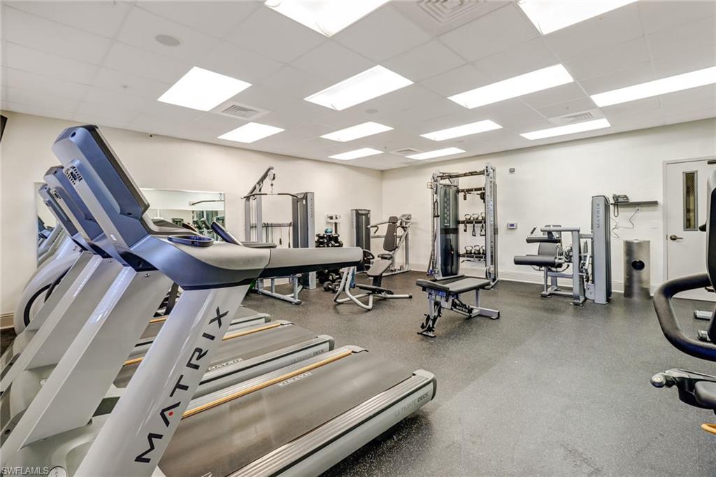 20741 Rivers Ford Estero, FL 33928 - Photo 44 of 50 a room with gym equipment and a view of living room