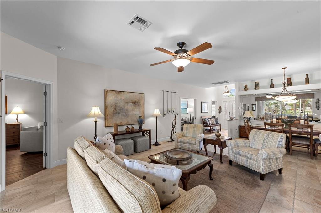 20741 Rivers Ford Estero, FL 33928 - Photo 5 of 50 a living room with furniture and a chandelier