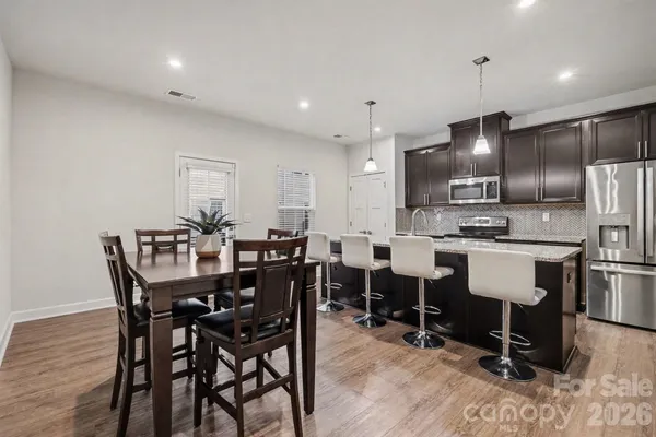 a view of a dining room with furniture
