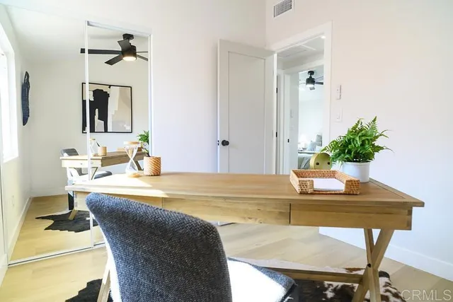 a dining room with table and chairs