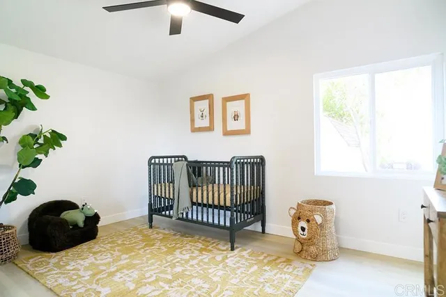 a bedroom with a bed and a chair