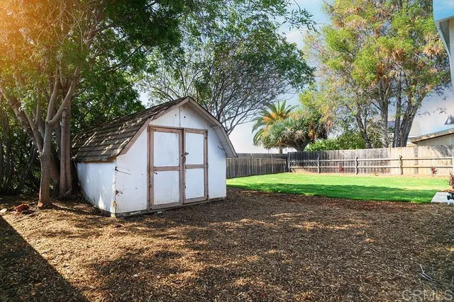 a view of a house with a yard and garage