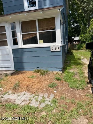 a view of a backyard of a house