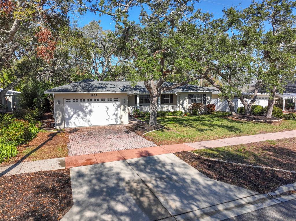 1608 Pinellas Road Belleair, FL 33756 - Photo 1 of 1 a view of a park with large trees