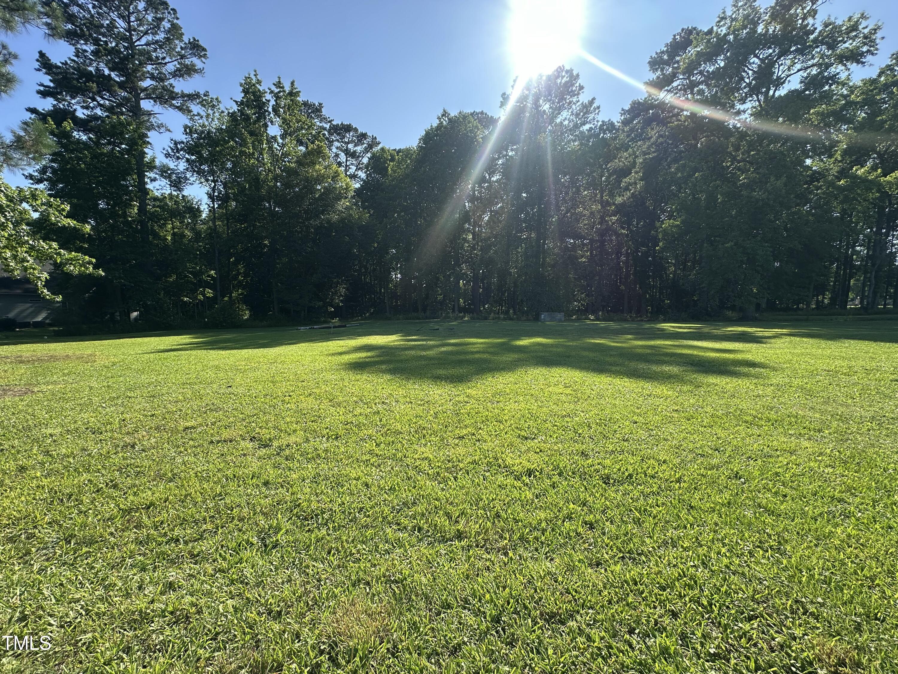 a view of a swimming pool with an outdoor space and seating area