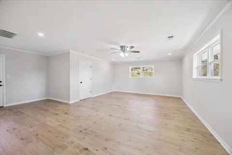 a view of an empty room and a window