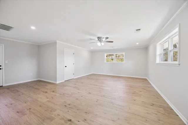 a view of an empty room and a window