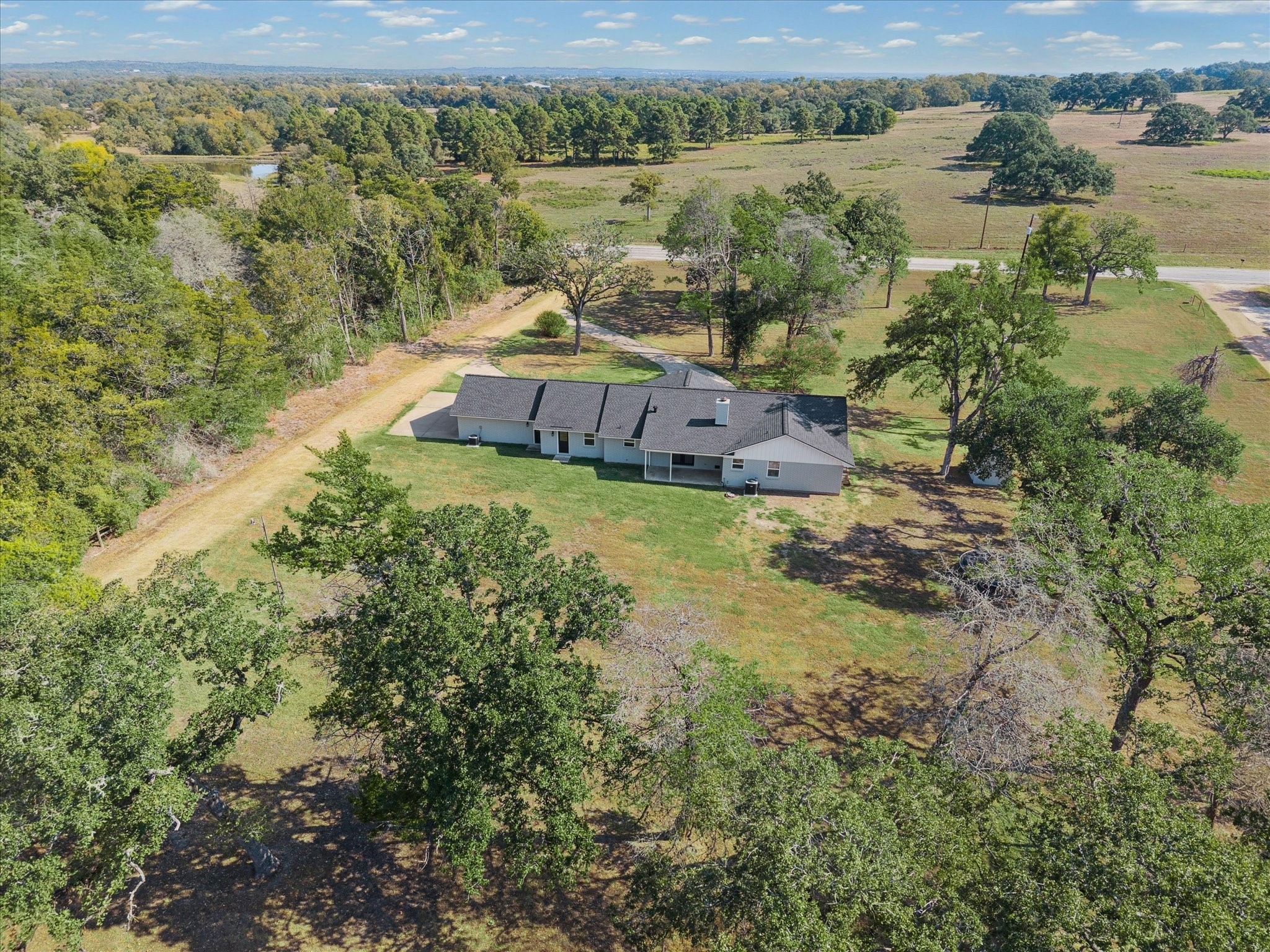 3455 Farm To Market 1948 Burton, TX 77835 - Photo 2 of 29 an aerial view of a house with a lake view