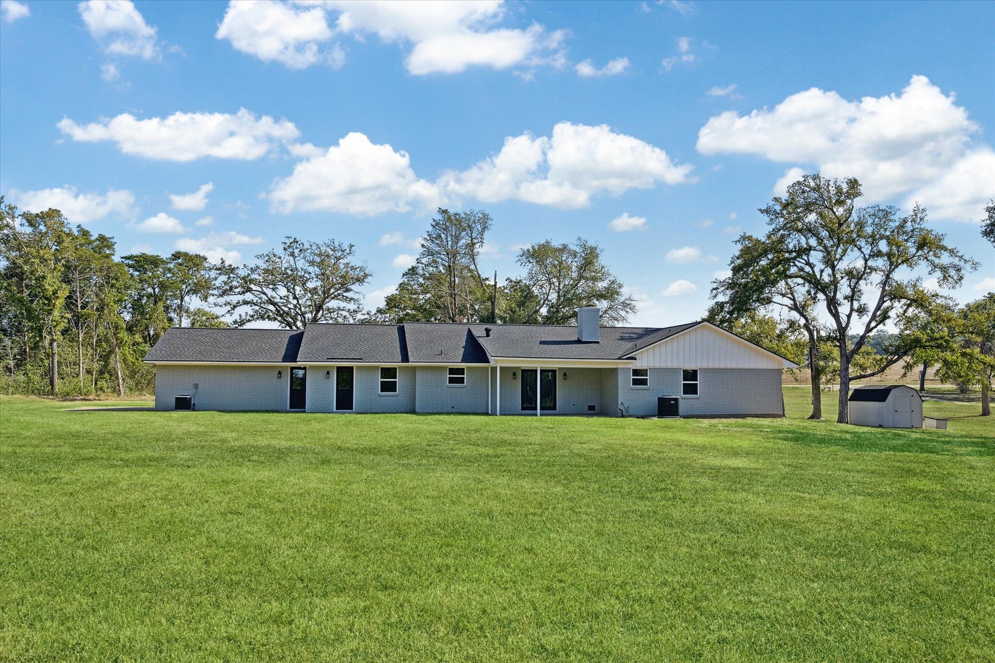 3455 Farm To Market 1948 Burton, TX 77835 - Photo 23 of 29 a view of a house with a big yard and large trees