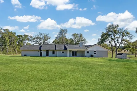 a view of a house with a big yard