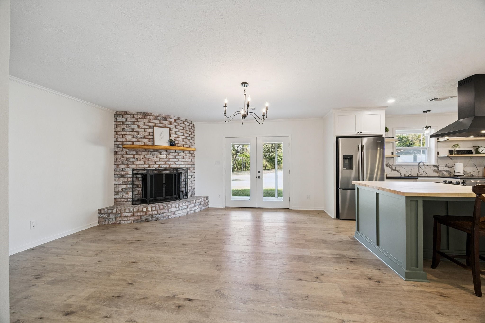 3455 Farm To Market 1948 Burton, TX 77835 - Photo 5 of 29 a view of a kitchen with a sink and a fireplace