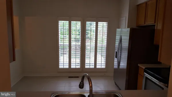 a view of a kitchen with a sink and windows