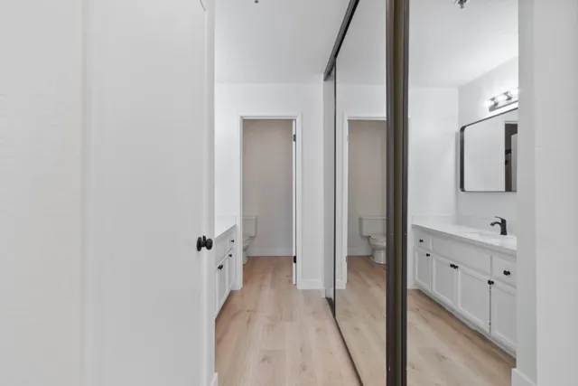 a bathroom with a double vanity sink and mirror