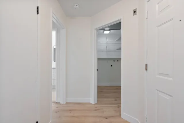 a view of a bathroom with wooden floor