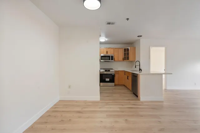 a view of kitchen with wooden floor