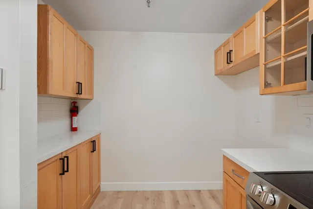 a kitchen with a sink and cabinets