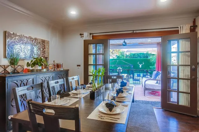 a kitchen with stainless steel appliances kitchen island granite countertop a table and chairs