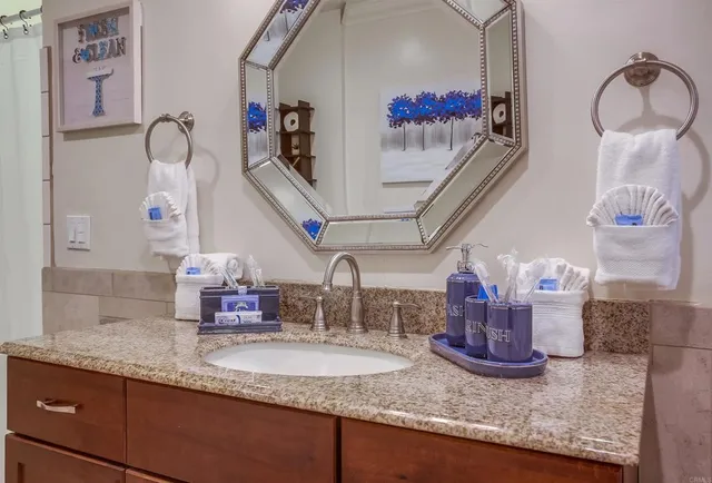 a bedroom with a bed a table and chair