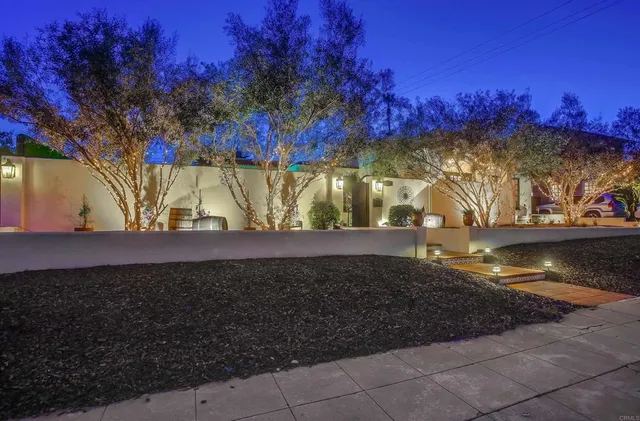 a view of a yard with large trees