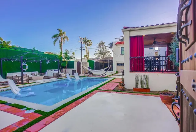 a view of a swimming pool with a lounge chairs