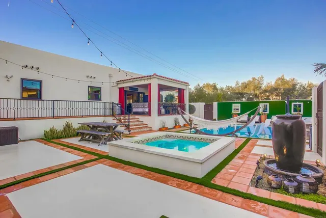 a view of a patio with a table and chairs