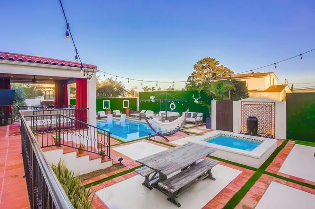 a balcony with furniture and garden view