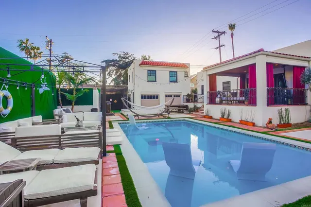 a spacious bedroom with a bed and a window