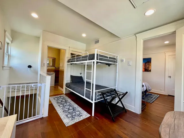 a bedroom with granite countertop a stove and a walk in closet