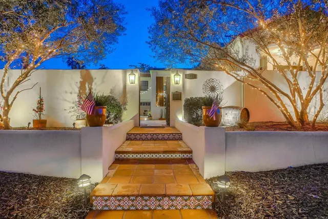a view of a patio with a table and chairs