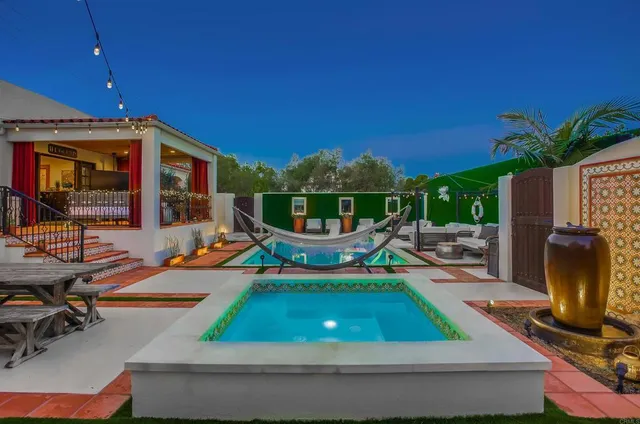 a view of a chairs and table in backyard