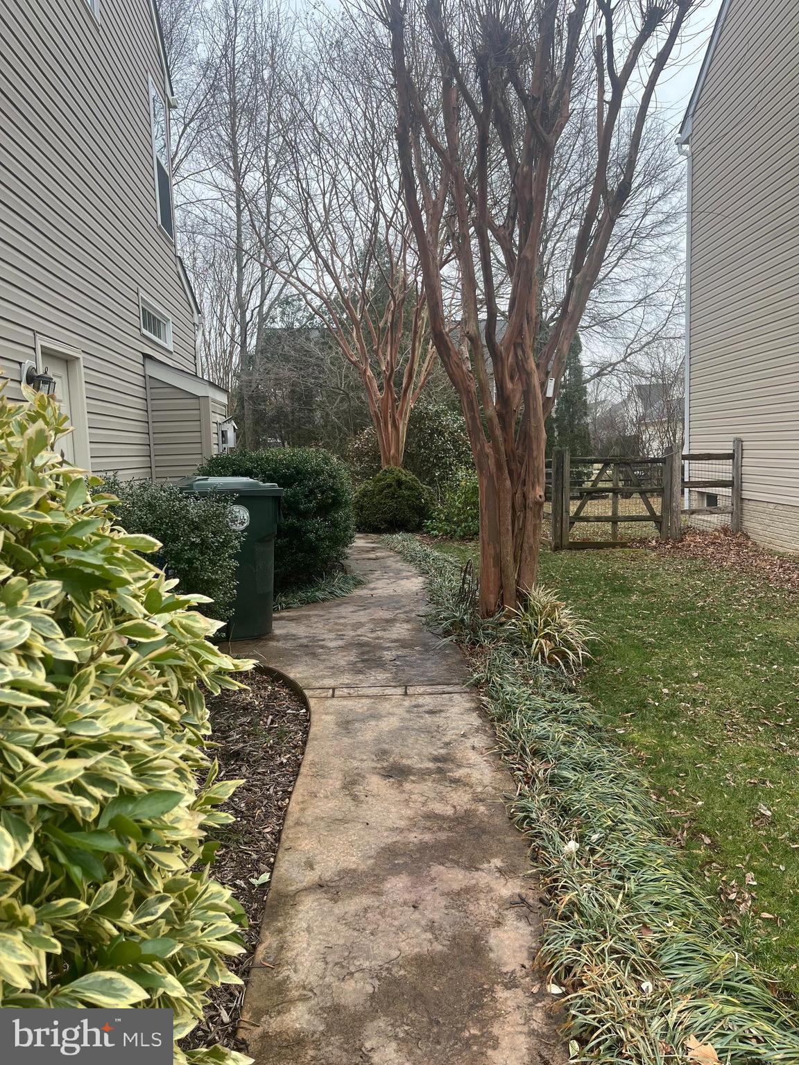 1733 Dearbought Drive Frederick, MD 21701 - Photo 4 of 7 a backyard of a house with table and chairs