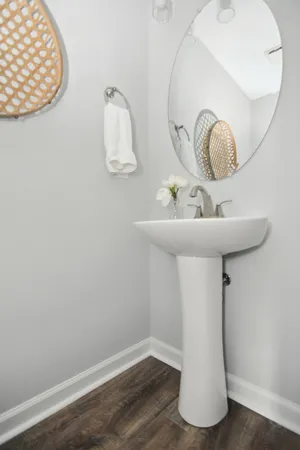 a bathroom with a sink and mirror