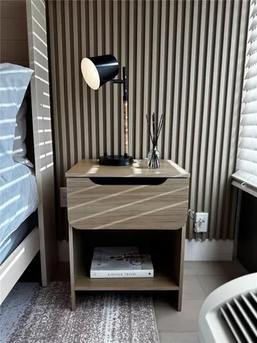 a bedroom with a bed and a table